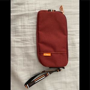 Chaco wristlet wallet Rust red color with Rose gold hardware. Perfect condition